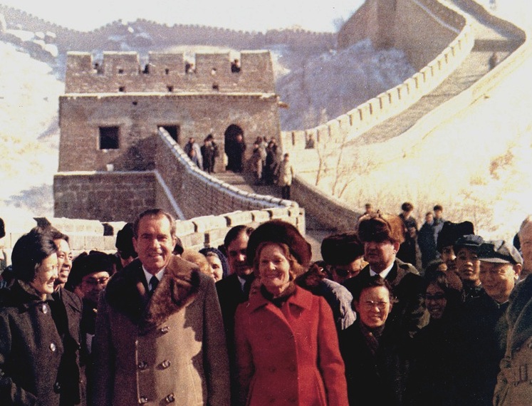 U.S. President Richard Nixon and First Lady Pat Nixon walk along the snow-covered Great Wall of China with Chinese officials and members of the delegation during the 1972 visit to China.