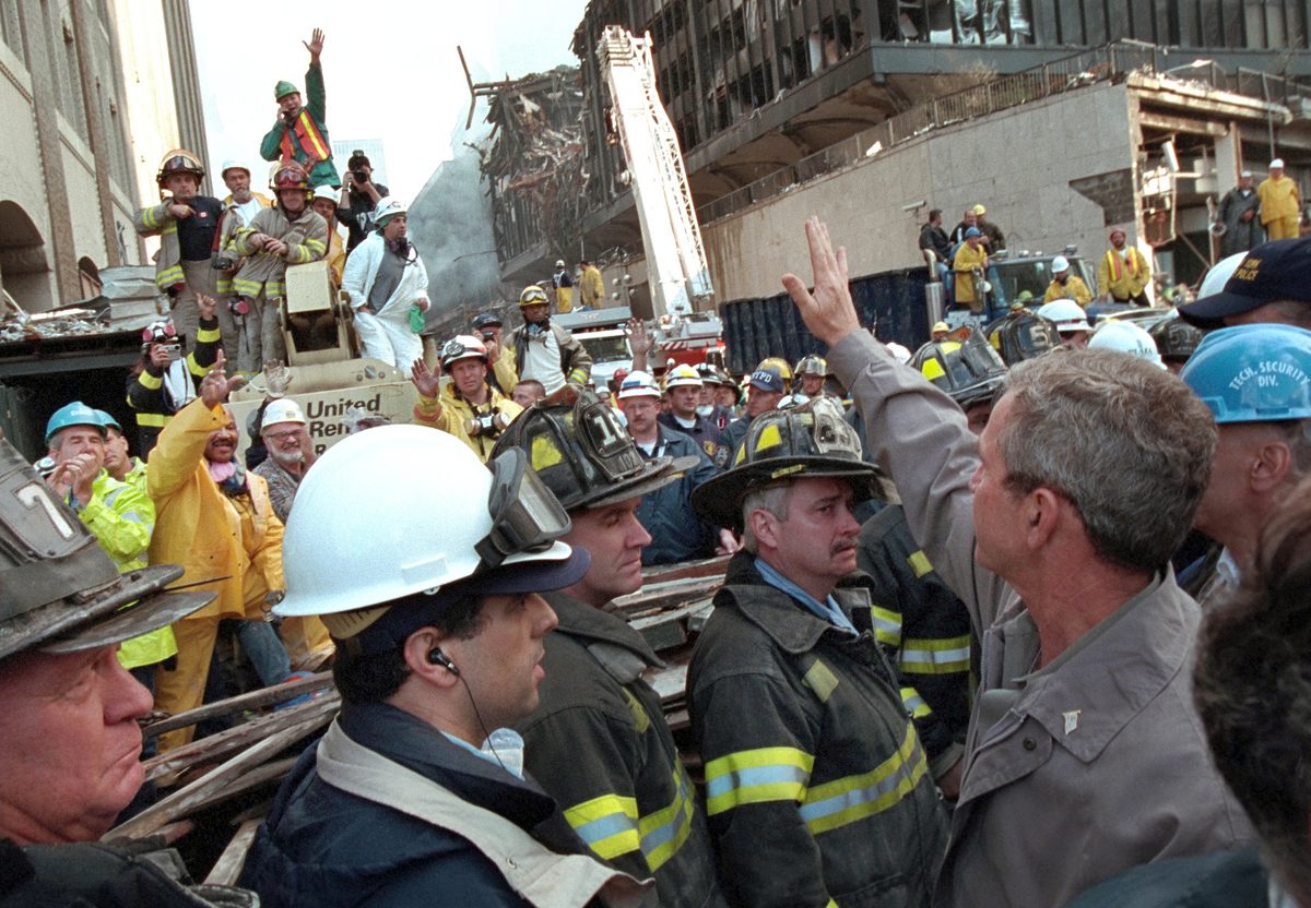 President Bush waving to rescue workers amid the rubble at Ground Zero